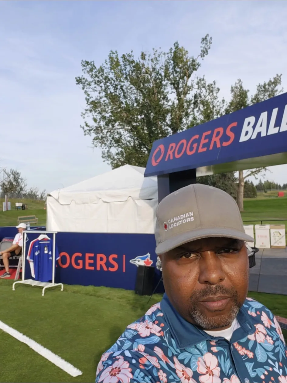 CLI team member in a Canadian Locators cap at the Rogers Charity Classic
